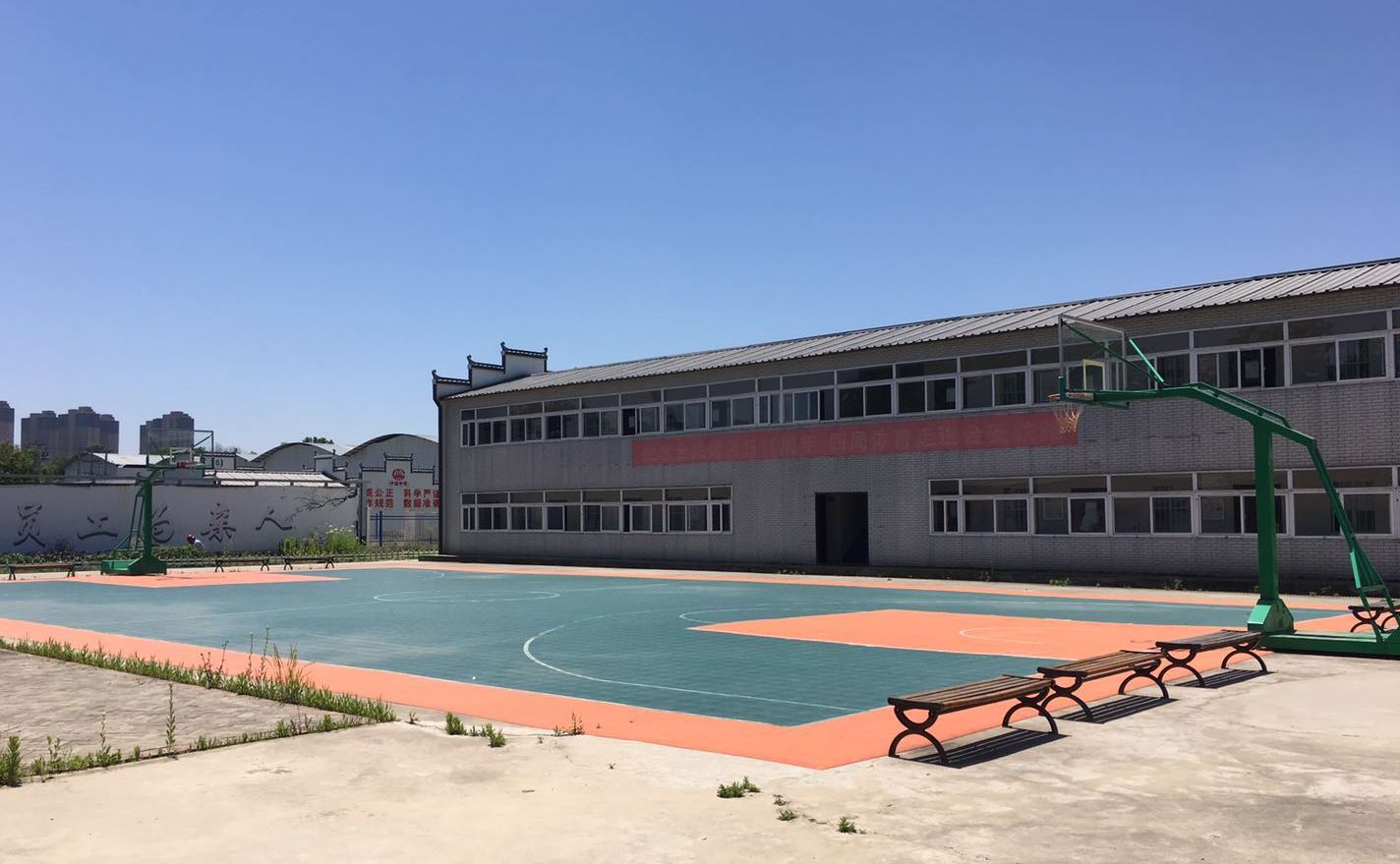 Specially built dormitories and facilities like a basketball court at the Feixi Precast Box Girder Factory are in contrast to the filthy and poor living conditions migrants workers are often subjected to. [Photo: Chinaplus]