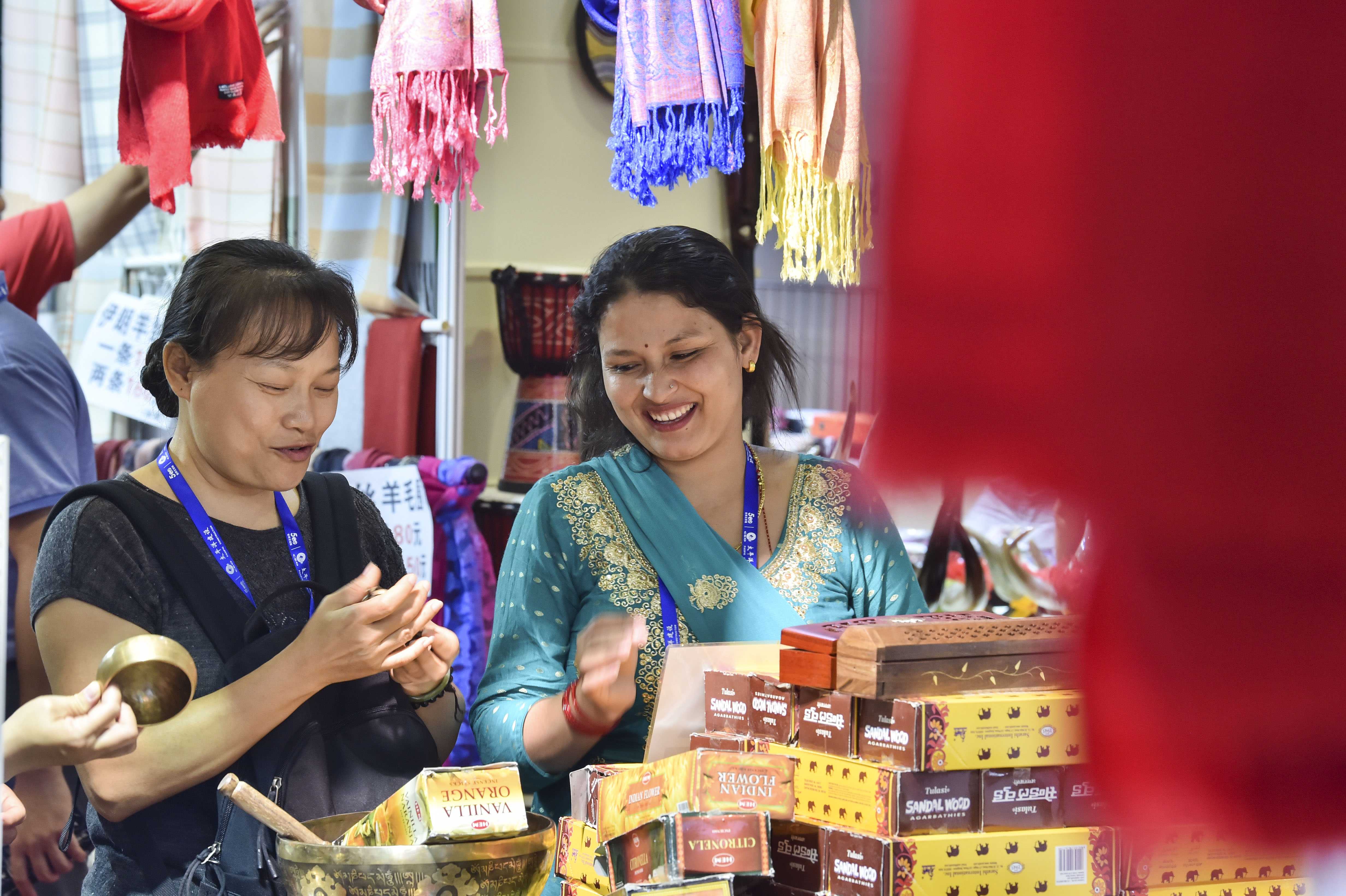 File Photo: Visitors choose Nepalese goods during the 16th China-ASEAN Expo in Nanning, capital of south China's Guangxi Zhuang Autonomous Region, Sept. 23, 2019. (Xinhua/Cao Yiming)